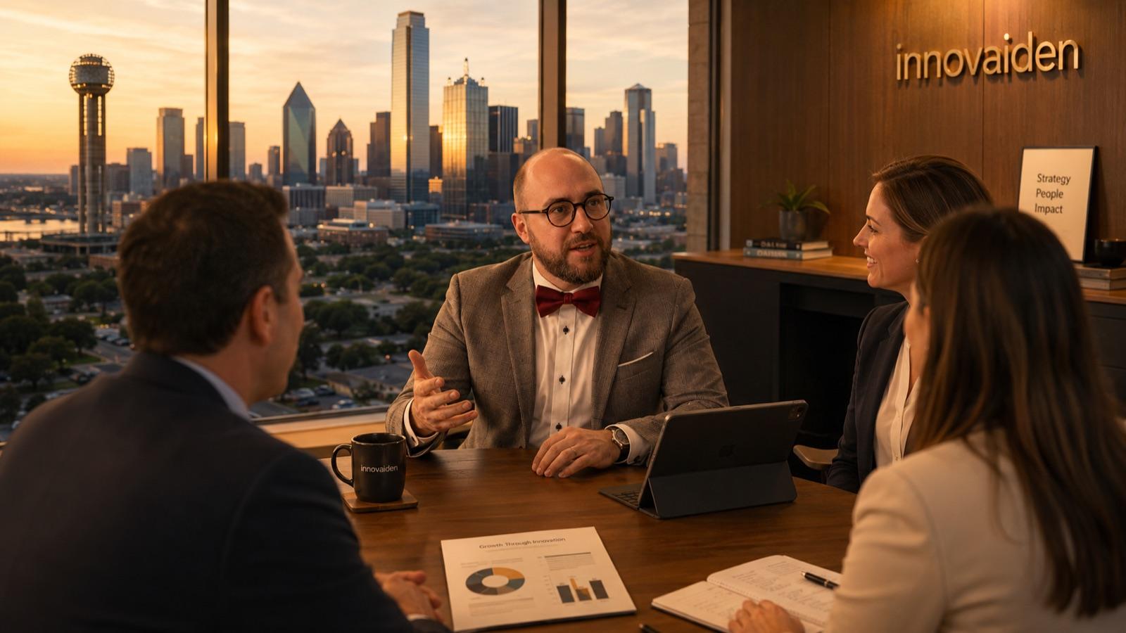 Dritan Saliovski presenting to the Innovaiden Dallas team with the Dallas skyline behind